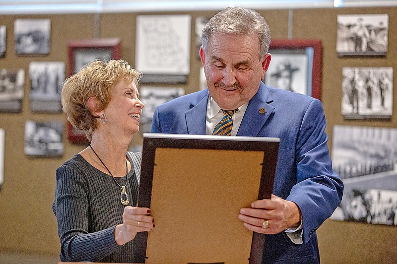 Ethan Weston/News Tribune
Former Sen. Doug Libla, right, reads a senate proclamation Thursday to his wife, Elaine Libla, commending her for her years of service to the Missouri Association of State Troopers Emergency Relief Society at the Missouri Highway Patrol Headquarters in Jefferson City. A wall in the headquarters’ museum was dedicated to Libla.