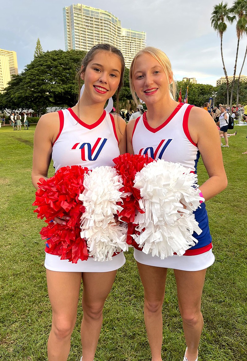 Submitted/MARIA HOLLOWAY
Isabella Holloway and Stormey Jo Pembleton were given the honor to perform in the 80th Anniversary Pearl Harbor Memorial Parade in Honolulu, Hawaii, on Dec. 7. They earned their places in the parade when they made NCA All-American Cheerleader at camp during the summer. The parade included survivors from Pearl Harbor. Holloway and Pembleton were also able to visit Pearl Harbor, the USS Arizona and the USS Missouri during their time there. There were more than 600 cheerleaders and dancers from every state in the U.S. but there were only four cheerleaders from Arkansas at the event.