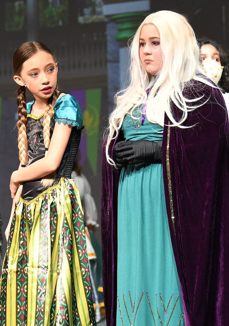 Rayleigh Rauda, as Anna, left, and Arabella Lampinen, as Elsa, rehearse for “Frozen,” a production by Main Street Visual and Performing Arts Magnet School. - Photo by Tanner Newton of The Sentinel-Record
