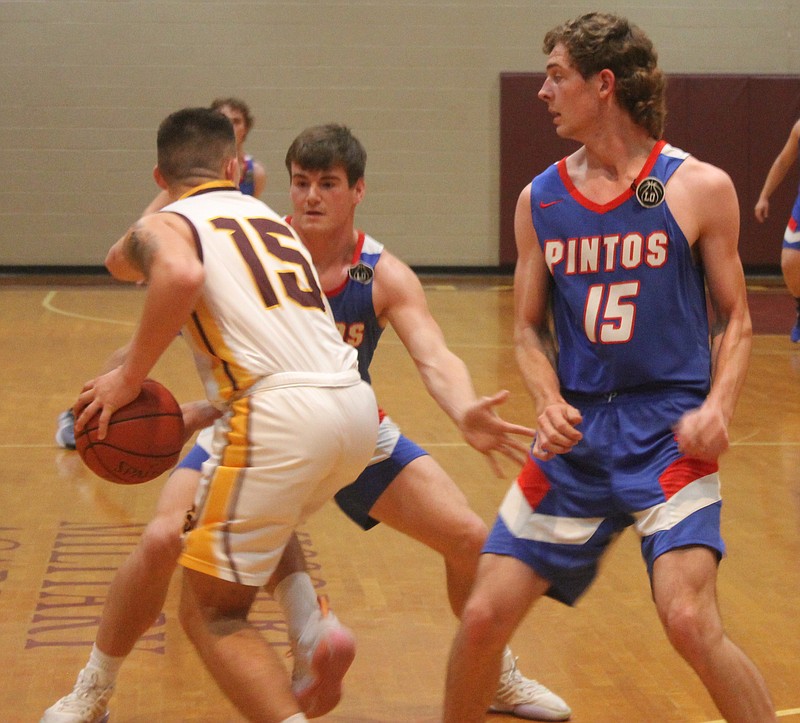 Democrat photo/Evan Holmes
Senior forward Trevor Myers (left) and junior forward Jaden Traschel (right) trap the Missouri Military Academy guard in the back court and force a turnover.