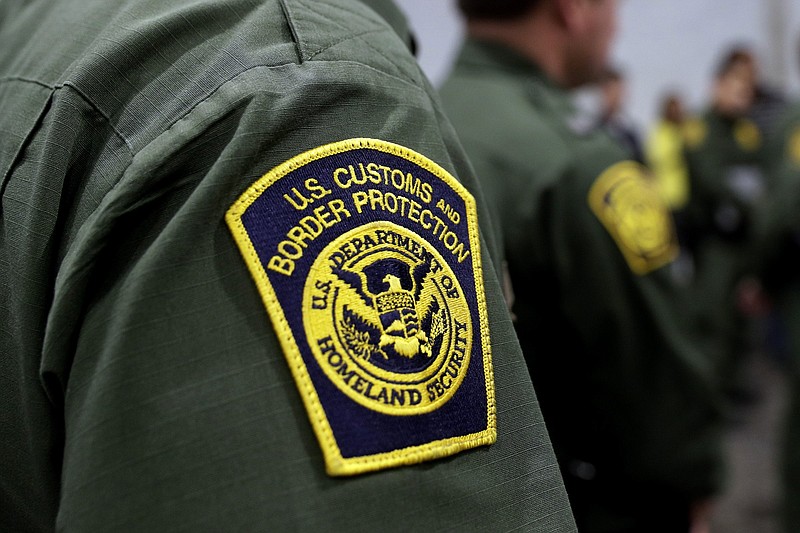 FILE - Border Patrol agents hold a news conference prior to a media tour of a new U.S. Customs and Border Protection temporary facility near the Donna International Bridge in Donna, Texas, May 2, 2019. A special Customs and Border Protection unit used sensitive government databases intended to track terrorists to investigate as many as 20 U.S.-based journalists, including a Pulitzer Prize-winning Associated Press reporter, according to a federal watchdog. (AP Photo/Eric Gay, File)