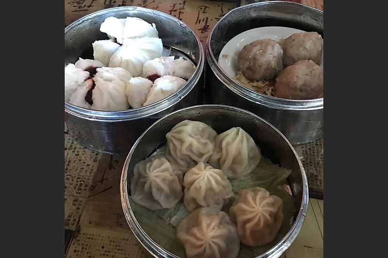 Dim sum, like these steamed meatballs (clockwise from top right), pork dumplings and barbecue pork buns at the original west Little Rock Chi’s, will be on the all-day menu at Chi’s Baohouse. (Democrat-Gazette file photo)