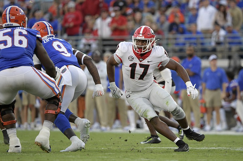 FILE- Georgia linebacker Nakobe Dean (17) follows a play during the second half of an NCAA college football game against Florida, Oct. 30, 2021, in Jacksonville, Fla. (AP Photo/Phelan M. Ebenhack)