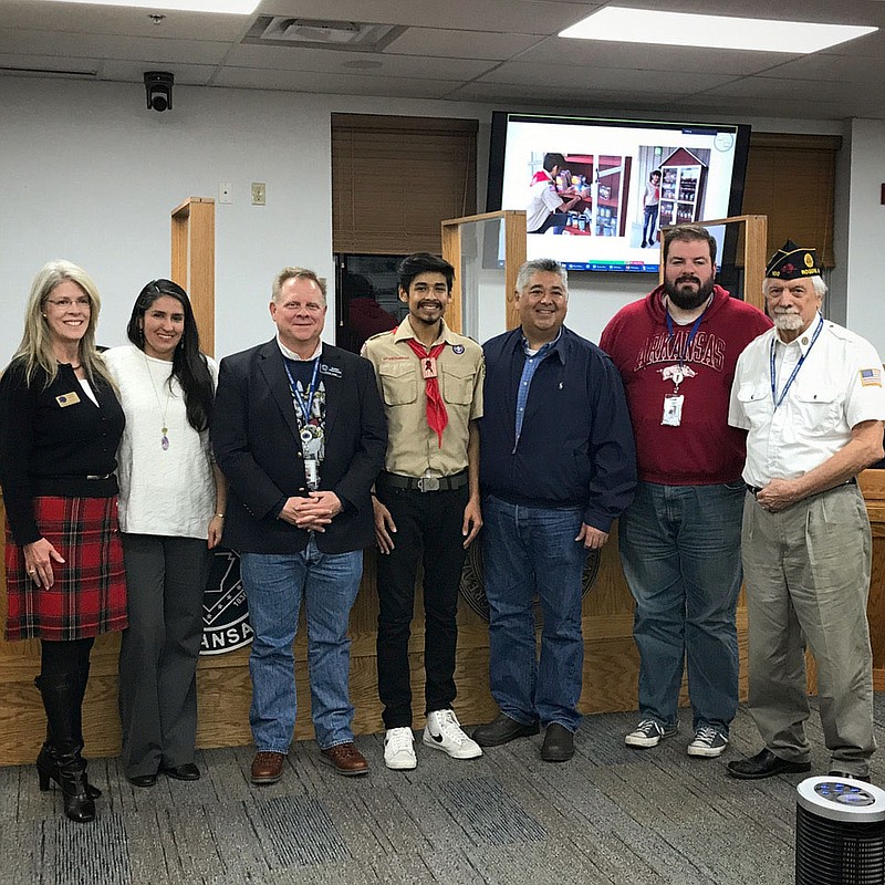 At the December Quorum Court meeting, Bentonville Boy Scout Angel Perez from Troup 2144 presented his Eagle Scout project to the Benton County Quorum Court. He constructed the large-scale model of the free little pantry concept at the entry of American Legion Post 100 in Rogers (across the Rogers post office). Perez wanted to accommodate more than just food donations. He wanted to have room in this self-sustaining pantry for people to donate paper goods, cleaning items, and hygiene products. The Post Commander Bob Bracy also spoke about their partnership with Boy Scout Troup 2144 and their activities and other service projects at Post 100. Troup 2144 is sponsored by Elks Lodge 2144 and American Legion Post 100, both in Rogers. Scout leaders are Pat and Larry Rippetoe and Chris and Kay Spence. Pictured from left are Justice of the Peace Carrie Perrien Smith; Angel’s mother, Ana Martinez, Benton County Judge Barry Moehring; Angel Perez; Angel’s father, Francisco Perez; Justice of the Peace Joel Jones; and American Legion Post 100 Commander Bob Bracy.

(Courtesy Photo)