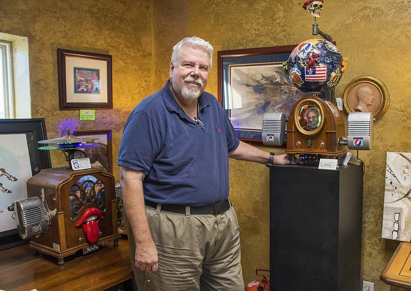 Cliff McGaha — with his Grateful Dead-theme Gizmo at Consign Design in North Little Rock — repurposes old parts to turn them into one-of-a-kind, high-end stereo systems. (Arkansas Democrat-Gazette/Cary Jenkins)