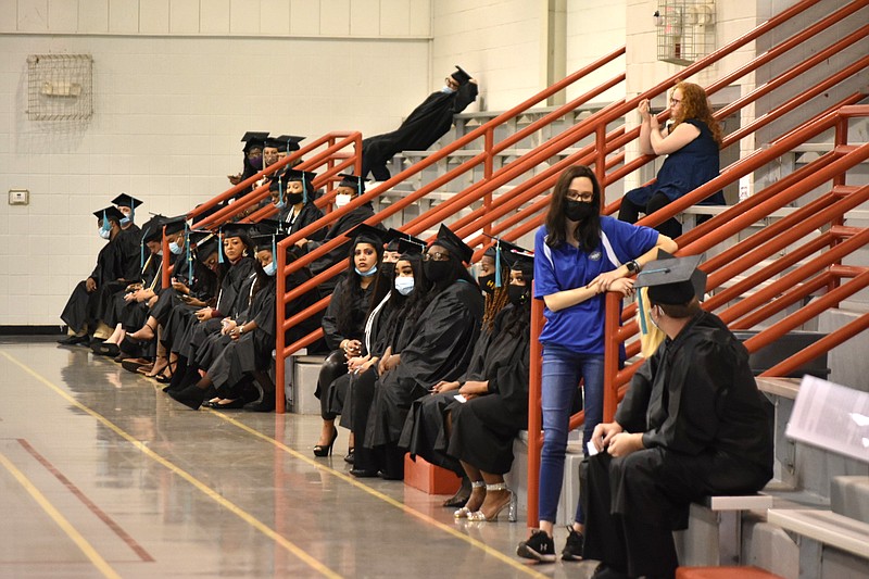 SEARK graduates wait for their names to be called to receive their degrees or certificates. (Pine Bluff Commercial/I.C. Murrell)