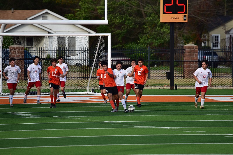Texas High junior varsity defenders clear the area in front of their goal during a 5-4 home win against the Carthage Bulldogs in their first game of the season. Tigers’ players, from left, Jonathan Torres, No. 17; Dawson Moser, No 11; Daniel Sanchez, No. 6; and Sean Jackson, No. 12. Photo by Richard Blake