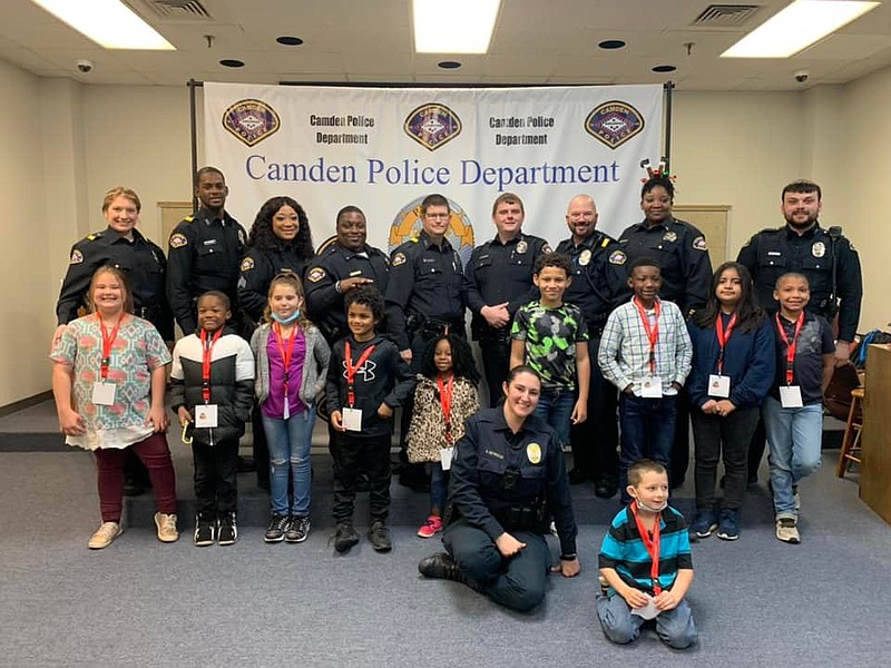 Photo courtesy of Camden Police Department
CPD officers stand with the participants of the 2021 Shop with a Cop program in which officers take area youth on a shopping trip to Wal-Mart.