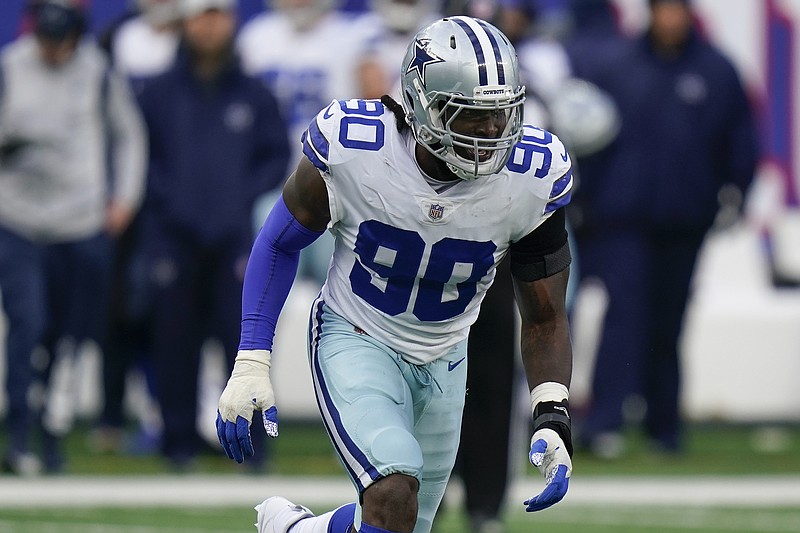 Dallas Cowboys defensive tackle Neville Gallimore (96) celebrates with fans  after an NFL football game against the New York Giants, Sunday, Dec. 19,  2021, in East Rutherford, N.J. The Dallas Cowboys defeated the New York  Giants 21-6. (AP Photo/Steve