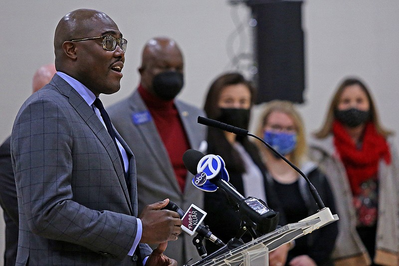 Mayor Frank Scott Jr., far left, speaks at a press conference about the Community Schools Initiative at the Stephens Community Center on Monday, Dec. 20, 2021. (Arkansas Democrat-Gazette/Colin Murphey)