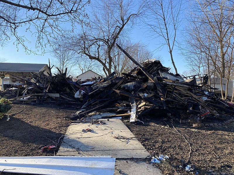 A week later, wreckage is all that remains from the fire, with some items still visible among the ash.