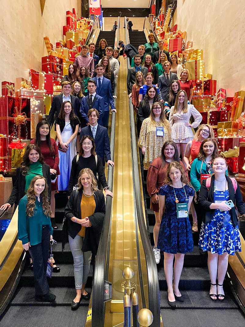 Arkansas 4-H sent 37 delegates from 17 counties to the 100th National 4-H Congress held Nov. 26-30 at Atlanta, Georgia. During their visit, the group enjoyed brunch at the Ritz Carlton Hotel and posed for a photo on the escalator. (Special to The Commercial)