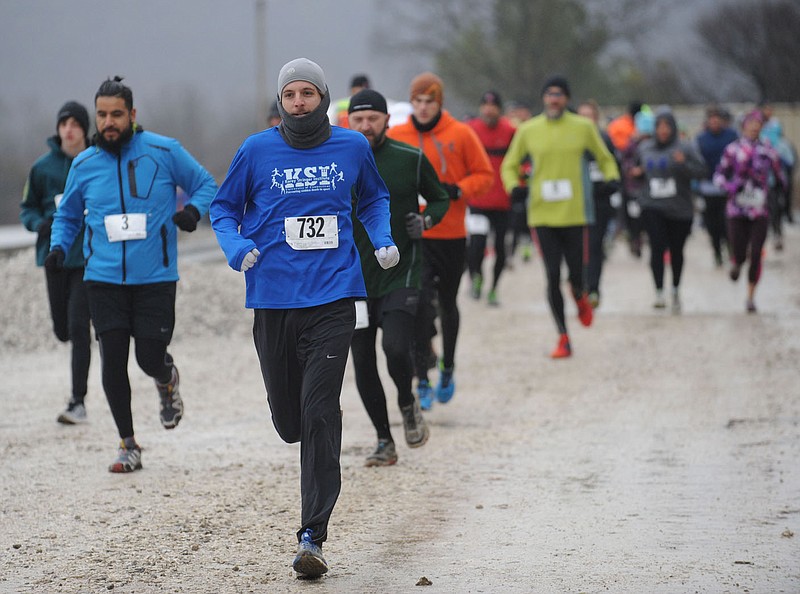 NWA Democrat-Gazette/ANDY SHUPE
Runners begin the Frozen Toes 15K Trail Run Saturday, Jan. 9, 2016, at Kessler Mountain in Fayetteville. The race was organized as a part of the Fayetteville Race Series by the Fayetteville Parks and Recreation Department and offered runners a view of the future home of the regional park before finishing with a hot bowl of soup.