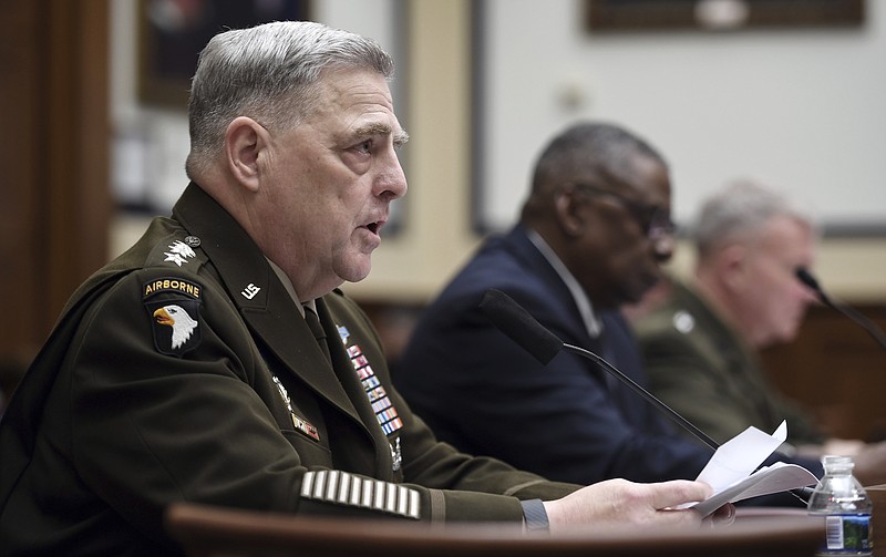 FILE - Gen. Mark Milley, chairman of the Joint Chiefs of Staff, testifies before the House Armed Services Committee on the conclusion of military operations in Afghanistan, Wednesday, Sept. 29, 2021, on Capitol Hill in Washington. In response to an Associated Press investigation that showed some stolen military guns were used in street crimes, Milley ordered the armed services to report a detailed accounting of missing firearms and explosives, which his office shared privately with Capitol Hill. (Olivier Douliery/Pool via AP, File)