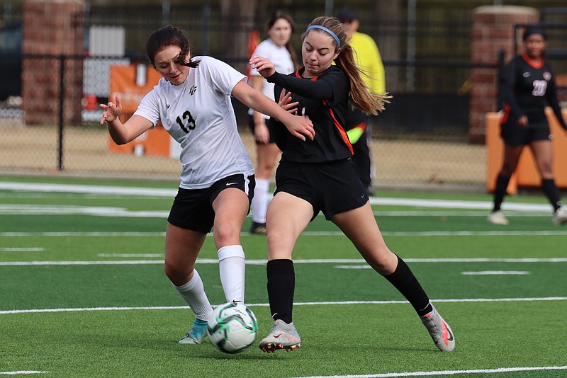 Aubrey Oller,left, and Annabeth Killian, right, fight for the ball during a game between Pleasant Grove and Texas High last season. (Photo courtesy of Melanie Allen/TXKSports)