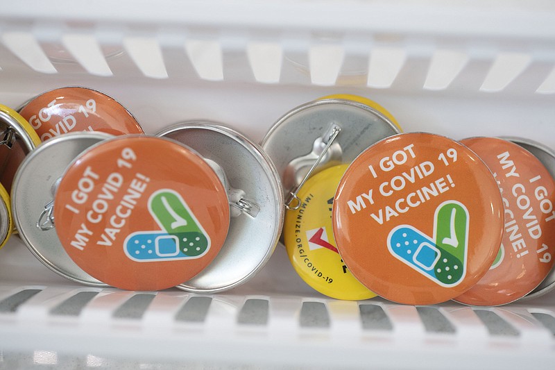 Buttons await the newly vaccinated Thursday Sept. 2, 2021 during a vaccine clinic at the clubhouse at Ozark Villas Apartments in Fayetteville. (NWA Democrat-Gazette File Photo/J.T. Wampler)