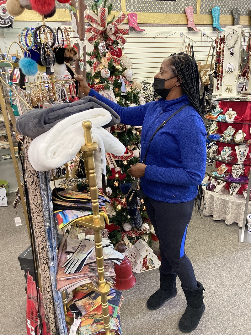 Trena Ford was taking care of some last-minute Christmas shopping on Friday at Captured Moments gift shop. (Pine Bluff Commercial/Byron Tate)
