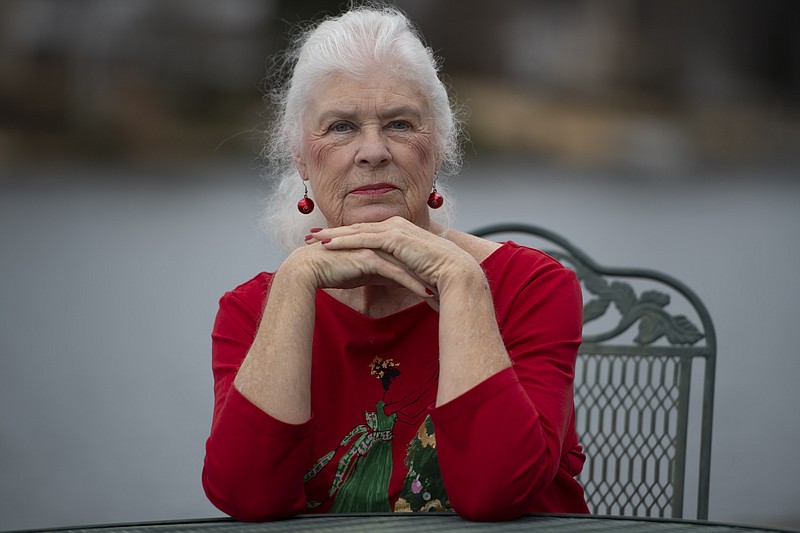 Wanda Olson poses for a photo, Friday, Dec. 17, 2021, in Villa Rica, Ga. When Olson&#x2019;s son-in-law died in March after contracting COVID-19, she and her daughter had to grapple with more than just their sudden grief. They had to come up with money for a cremation. Even without a funeral, the bill came to nearly $2,000, a hefty sum that Olson initially covered. (AP Photo/Mike Stewart)