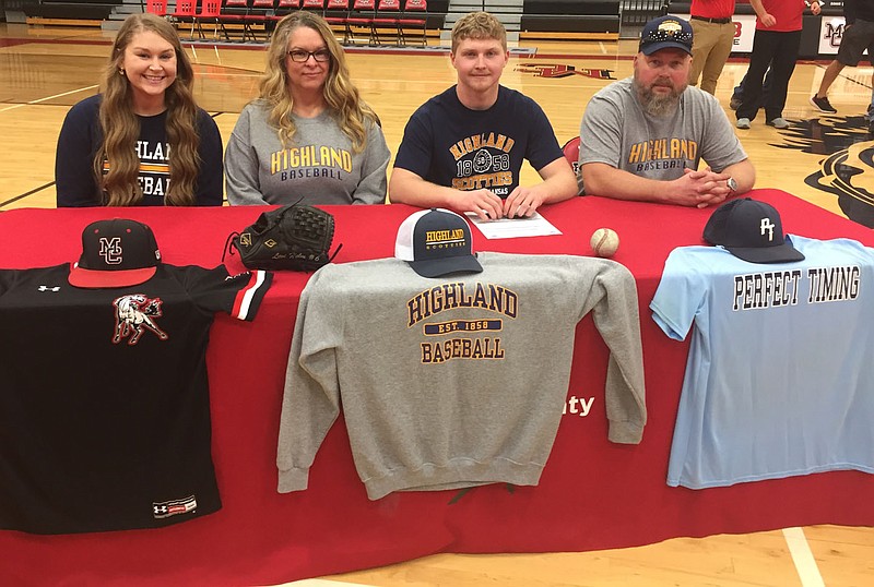 Photo Submitted
Senior pitcher Levi Helm (center) signed to play for Highland (Kan.) Community College.