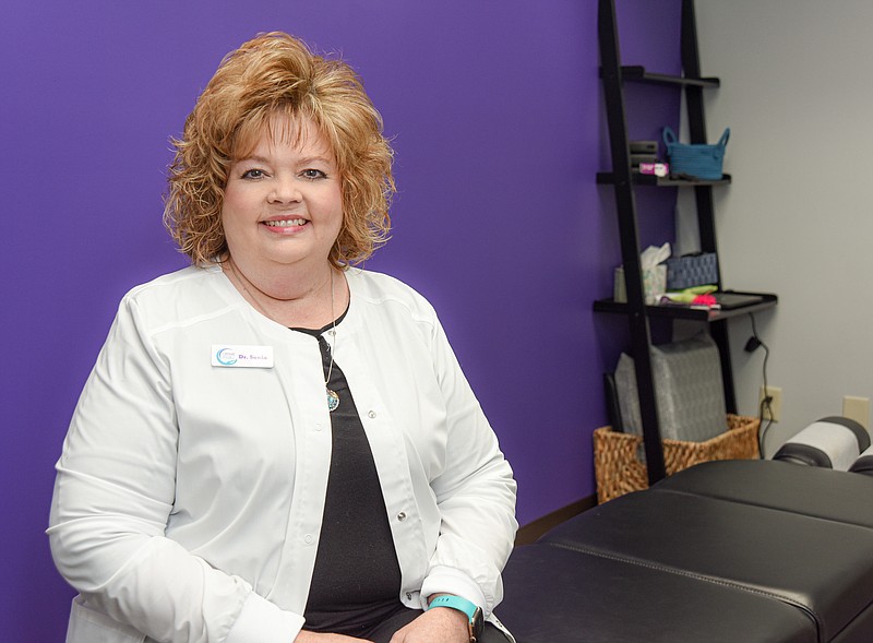 Julie Smith/News Tribune
Dr. Sonia McGowin poses in one of the treatment rooms at Covenant Chiropractic in Hyde Park.