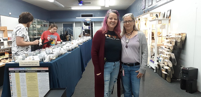 Sheila Lemley, left, stands with one of her staffers, Mary Sackett. The two of them, along with others like Shannon Pickering, along with the customers, ensure the success of Crystal Moon Metaphysical Boutique, a new feature in the downtown business and cultural scene in Texarkana. (Staff photo by Junius Stone)
