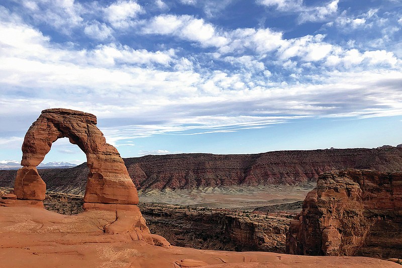 FILE - Delicate Arch is seen at Arches National Park on April 25, 2021, near Moab, Utah. As the world nears its third year of the COVID-19 pandemic, there is at least one industry that is bouncing back &#x2014; Utah travel and tourism. (AP Photo/Lindsay Whitehurst, File)