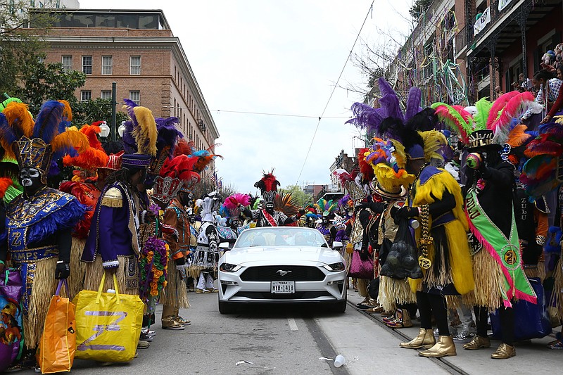 Members of the Zulu Social Aid and Pleasure Club parade down St. Charles Avenue during Fat Tuesday celebrations on Feb. 25, 2020, in New Orleans. (Jonathan Bachman/Getty Images/TNS)