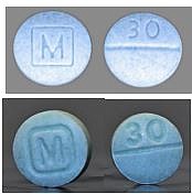 Authentic oxycodone M30 tablets (top) vs. counterfeit oxycodone M30 tablets containing fentanyl (bottom) as pictured on a May 2021 fact sheet issued by the U.S. Drug Enforcement Administration.