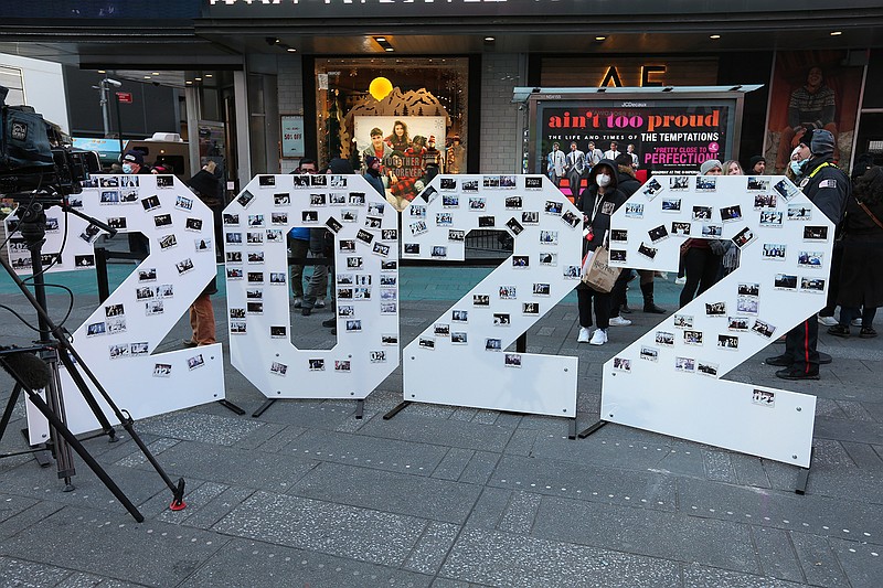 A photo wall of polaroids taken by visitors at the arrival of the 2022 New Year's Eve Numerals in Times Square on Dec. 20, 2021, in New York. (Rob Kim/Getty Images/TNS)