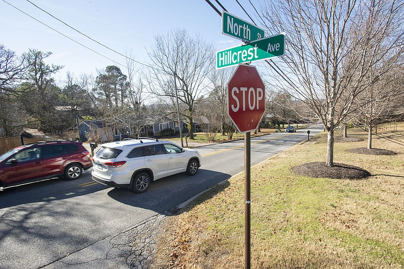 Motorists using North Street in Fayetteville on Thursday, Dec. 30, 2021, pass by the Hillcrest Avenue intersection. The city is proposing a redesign of North Street from Garland Avenue to Mission Boulevard, with a small roundabout potentially at Hillcrest Avenue. (NWA Democrat-Gazette/J.T. Wampler)