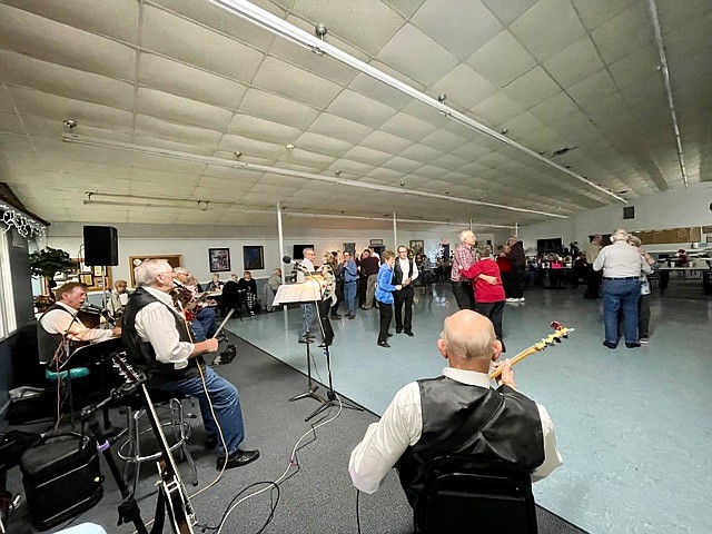 Guests dance to music provided by the Osage Drifters for the California Nutrition Center's New Year's Eve party. The event on Dec. 31, 2021, was the Nutrition Center's first New Year's party since the start of the coronavirus pandemic. (Democrat photo/Kaden Quinn)