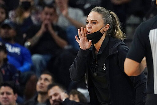 FILE - San Antonio Spurs assistant coach Becky Hammon during the first half of an NBA basketball game against the Dallas Mavericks, Friday, Nov. 12, 2021, in San Antonio.  Hammon is finalizing a deal to become the next coach of the Las Vegas Aces. A person familiar with the situation confirmed the move to The Associated Press on condition of anonymity because no official announcement has been made. She&#x2019;s expected to be the highest paid coach in the WNBA, earning way more than the highest paid player in the league.   (AP Photo/Eric Gay, File)