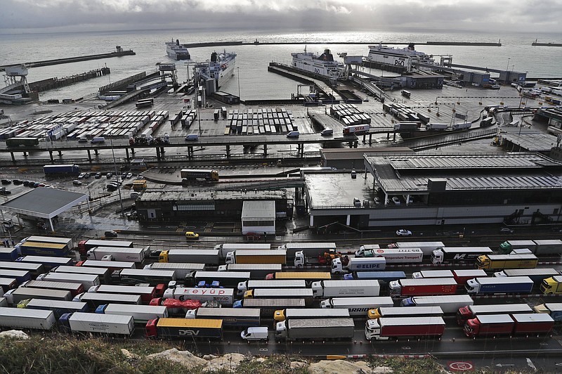 FILE - Lorries queue at Check-in at the port in Dover, on Dec. 11, 2020. Beginning on Jan. 1, importers must make a full customs declaration on goods entering the U.K. from the EU or other countries. Businesses will no longer be allowed to delay completing full import customs declarations for up to 175 days -- a measure that was introduced to cope with the disruption of Brexit.CThe British Frozen Food Federation said this week the new restrictions on animal and plant products from the EU could result in major delays at ports in the New Year. (AP Photo/Frank Augstein)