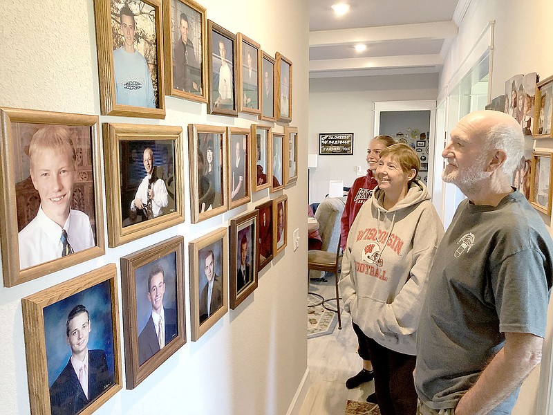 DENISE NEMEC SPECIAL TO ENTERPRISE-LEADER
Rich and Carol Bundsgaard and their exchange student, Fiena Klemmer, took at photos on the walls of other exchange students who have been in the Bundsgaard's home over the years.