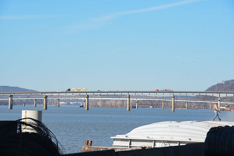 A man works at the Port of Van Buren by the Arkansas River on Thursday, Jan. 13, 2022, in Van Buren. Sen. Mat Pitsch, executive director of the Western Arkansas Intermodal Authority, recently briefed the authority's board of directors on a concept study plan report for the proposed development of an intermodal facility that would be located on the Arkansas River in Van Buren. Visit nwaonline.com/220116Daily/ for today's photo gallery.
(NWA Democrat-Gazette/Hank Layton)