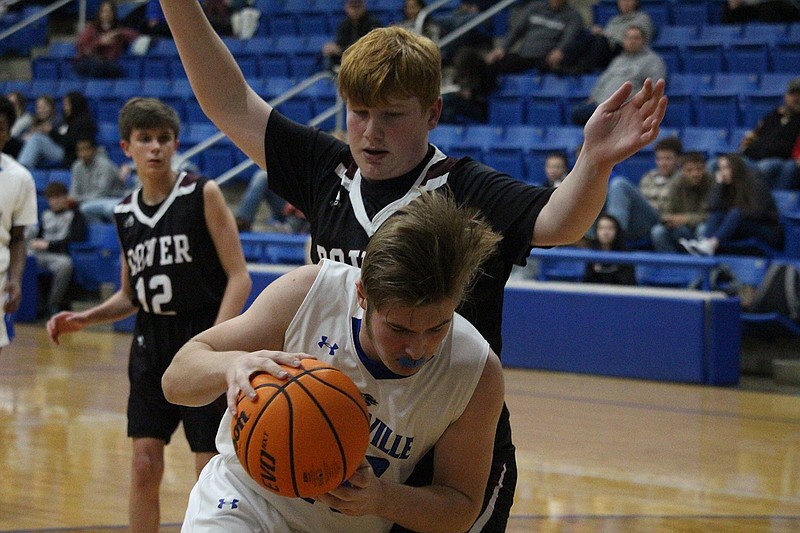 Jessieville's Ethan Lewis (40) posts up in the paint against Dover at Jessieville Sports Arena Friday night. - Photo by Krishnan Collins of The Sentinel Record