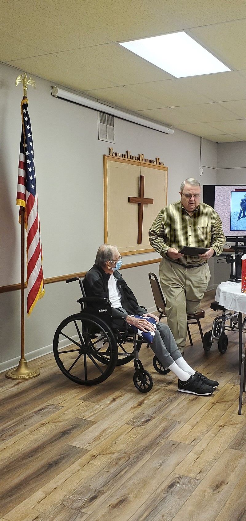 Photo by Bradly Gill
Ouachita County Judge Robert McAdoo proclaims January 12 as    Warren Broome Day at Broome's 100th birthday party held at the Fairview Methodist Church.