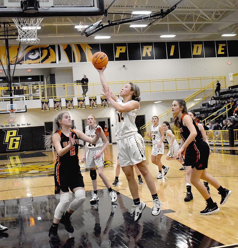 MARK HUMPHREY  ENTERPRISE-LEADER/Prairie Grove senior Trinity Dobbs gets a shot up in the paint during Friday's 53-47 loss to Gravette in 4A-1 girls basketball action at Tiger Arena. Dobbs scored 21 points to lead the Lady Tigers in the game.