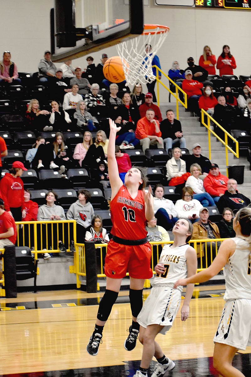 MARK HUMPHREY  ENTERPRISE-LEADER/Farmington sophomore Reese Shirey, shown scoring against Prairie Grove on Tuesday, Jan. 4, put 15 points on the scoreboard during the Lady Cardinals' 76-37 rout of defending Class 4A State champion, Harrison, on Friday, Jan. 7, 2022.