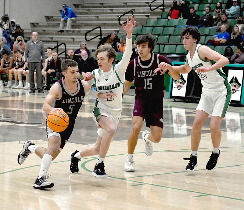 MARK HUMPHREY  ENTERPRISE-LEADER/Lincoln senior Kyler Calvin tries to turn the corner while sophomore Drew Moore steps up to try and screen the man guarding Calvin. Lincoln beat Greenland, 59-49, in 3A-1 Conference boys basketball action on the road Friday.