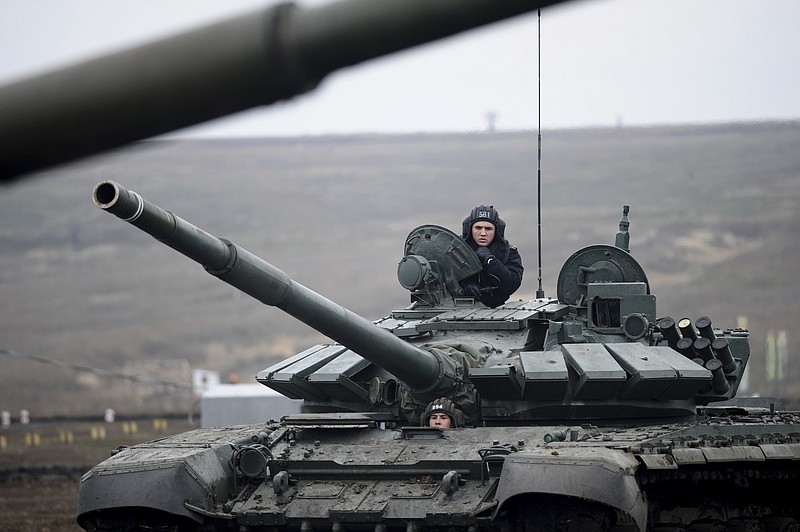 FILE - Russian troops take part in drills at the Kadamovskiy firing range in the Rostov region in southern Russia, Dec. 14, 2021. With the fate of Ukraine and potentially broader post-Cold War European stability at stake, the United States and Russia are holding critical strategic talks that could shape the future of not only their bilateral ties but the relationship between the U.S. and its NATO allies. Prospects are bleak. (AP Photo, file)