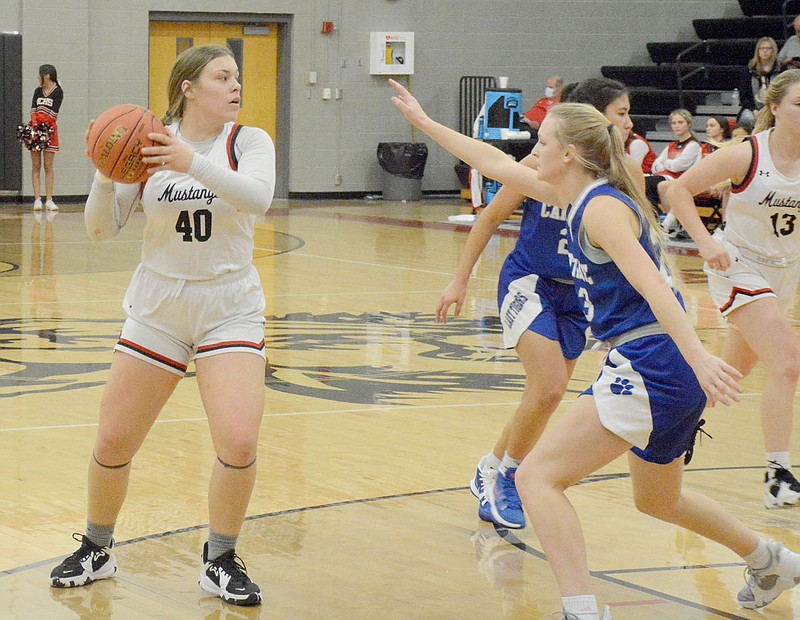 GRAHAM THOMAS/MCDONALD COUNTY PRESS
McDonald County senior Addy Leach, left, looks to make a play during last Thursday's game against Carthage at Mustang Arena. Carthage defeated the Lady Mustangs 53-32.