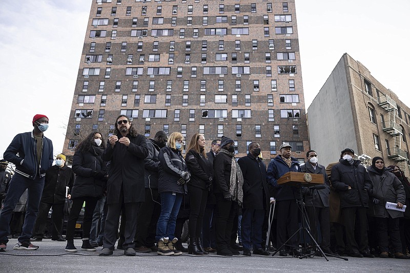 New York City Mayor Eric Adams speaks during a news conference outside the apartment building which suffered the city's deadliest fire in three decades, in the Bronx borough of New York on Monday, Jan. 10, 2022. (AP Photo/Yuki Iwamura)