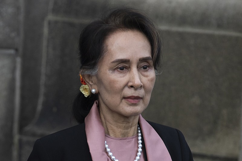 FILE - Myanmar's leader Aung San Suu Kyi leaves the International Court of Justice after the first day of three days of hearings in The Hague, Netherlands, on Dec. 10, 2019. A court in Myanmar on Monday, Jan. 10, 2022, sentenced the country's ousted leader, Aung San Suu Kyi to 4 more years&#x2019; imprisonment after finding her guilty of illegally importing and possessing walkie-talkies and violating coronavirus restrictions,a legal official acquainted with the cases said. (AP Photo/Peter Dejong, File)
