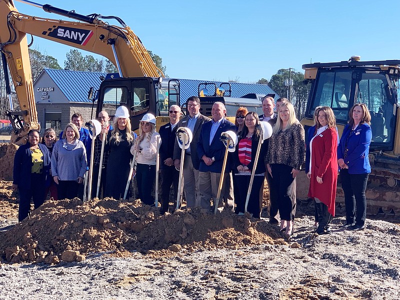 Simmons Bank staff are joined by White Hall city officials and White Hall Chamber of Commerce at the bank's groundbreaking ceremony Jan. 11 for a new branch at White Hall. (Special to The Commercial)