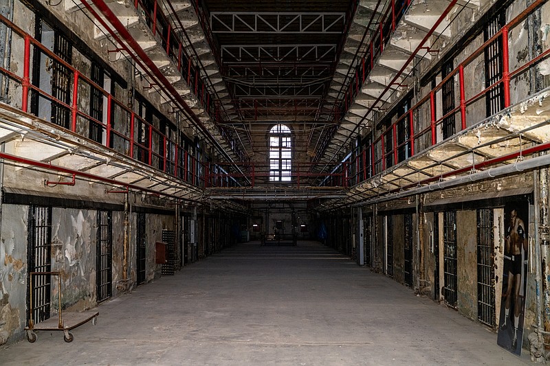 Ethan Weston/News Tribune Old prison cells line the walls floor to ceiling in housing unit 4 of the Missouri State Penitentiary on Thursday, Jan. 13, 2022. The unit is opening its doors for tours again on Wednesday, March 2, 2022 after damage from the 2019 tornado forced it to close. Preservation efforts have been underway in the building since.