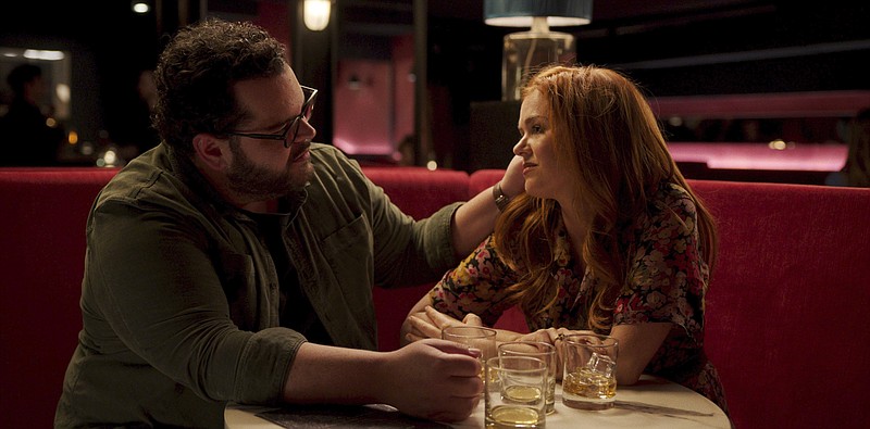 Josh Gad (left) and Isla Fisher perfrom in a scene from “Wolf Like Me,” a six-part series that debuted Thursday on Peacock. (Peacock via AP)