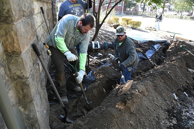 Workers dig a trench on Arlington Lawn in Hot Springs National Park on Wednesday to install a new backup generator. - Photo by Tanner Newton of The Sentinel-Record
