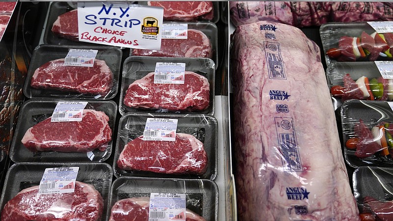 In this Tuesday, June 15, 2021 photograph, beef is displayed in the meat department at Lambert's Rainbow Market, in Westwood, Mass. Prices at the wholesale level surged by a record 9.6% in November 2021, from a year earlier, an indication of on-going inflation pressures The Labor Department said that its producer price index, which measures inflation before it reaches consumer, rose 0.8% in November compared to October, the highest monthly reading since June.(AP Photo/Charles Krupa)