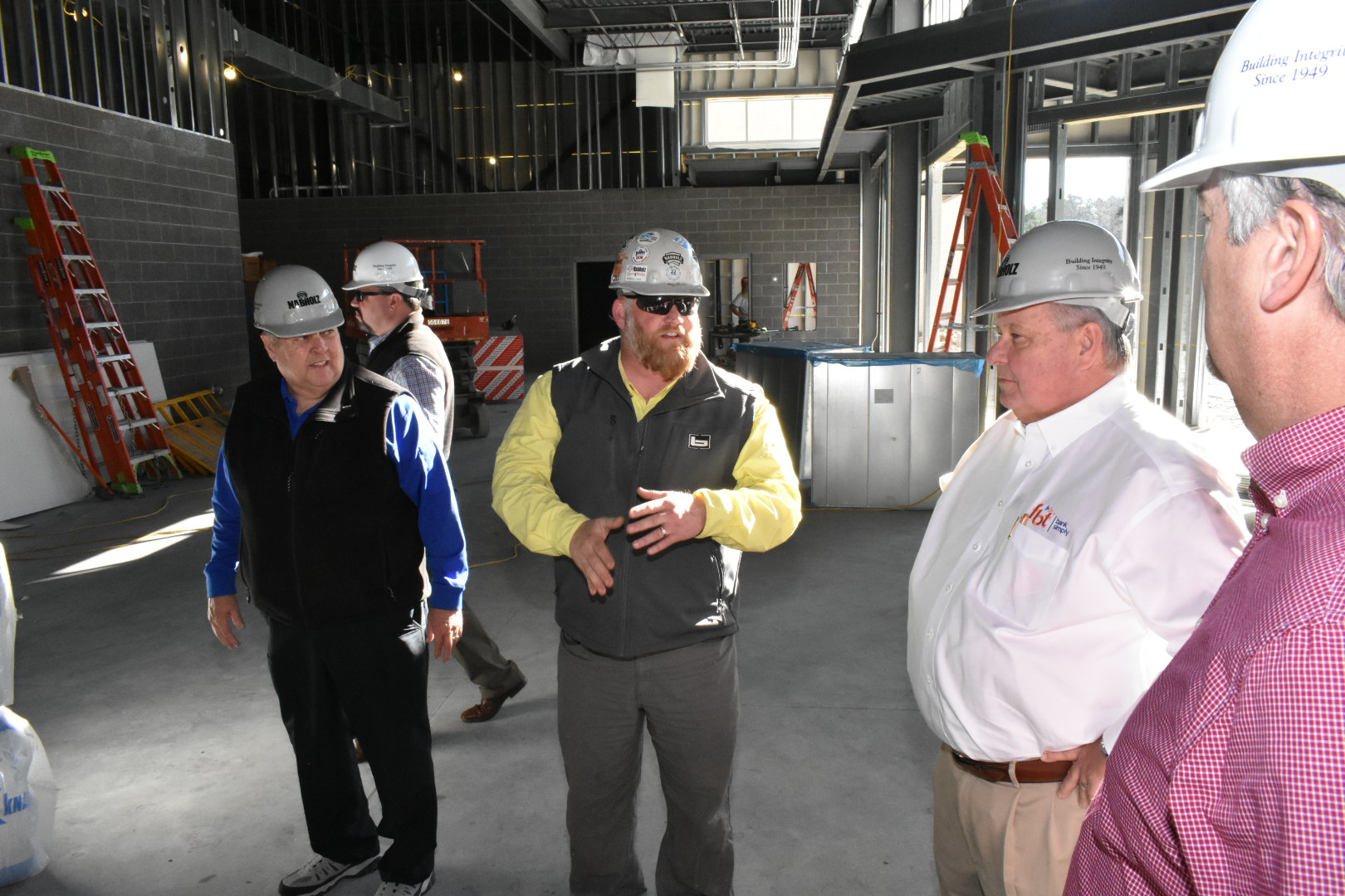 I-beam tops off school’s fine arts site